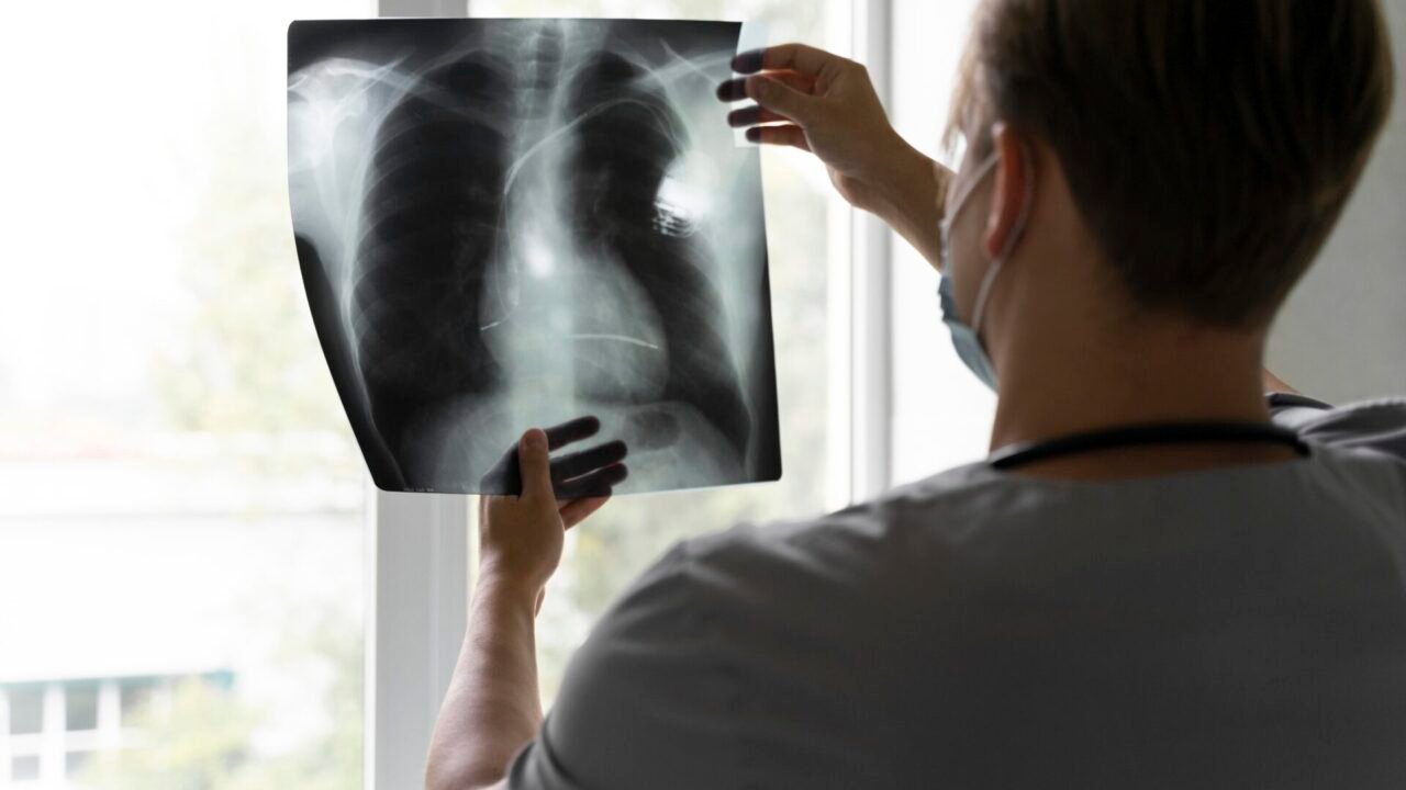 back-view-doctor-looking-radiography