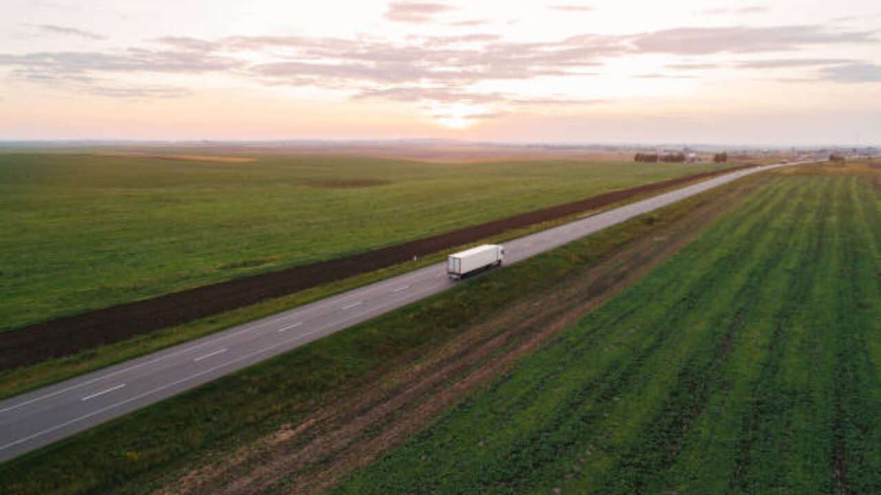 Aerial view of cargo trucks on the road in countryside in Ukraine