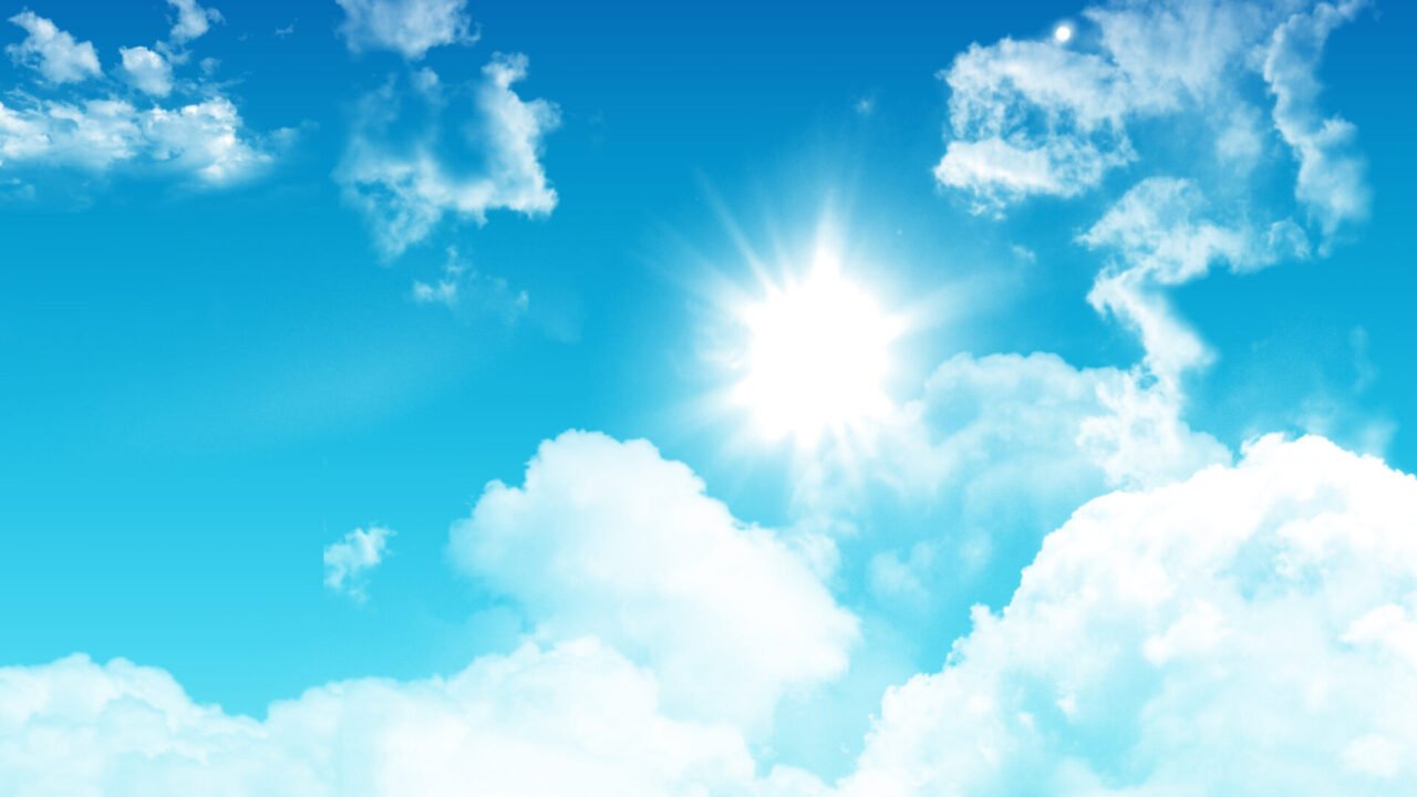 3D render of a blue sky with fluffy white clouds