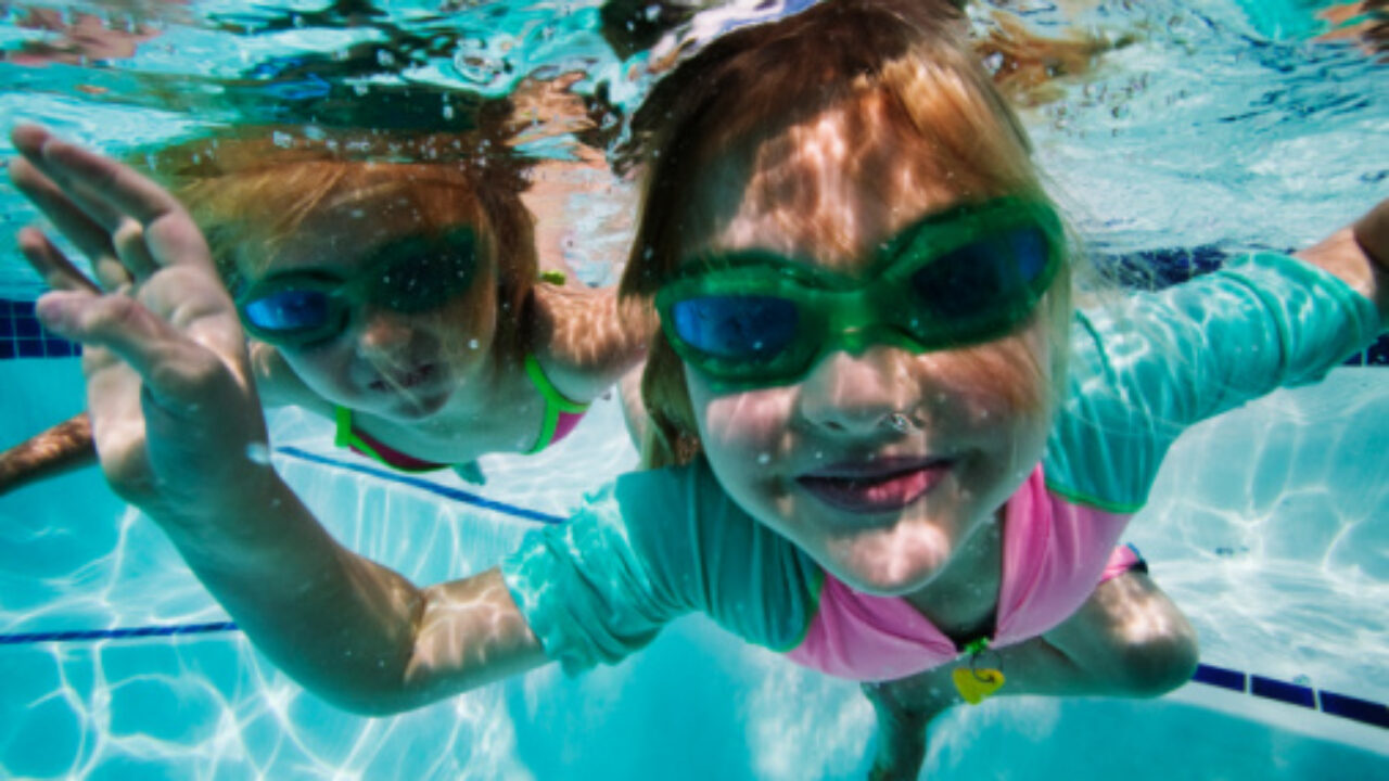 Girls (5-7) swimming under water. Models Released.